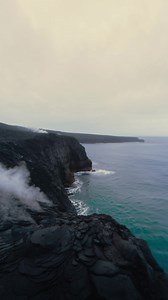 As lava meets water, violent reactions erupt along the shoreline—hissing steam, flying embers, and glowing fragments scattering into the surf. The ocean churns aggressively, waves illuminated in flashes of orange and red from the molten flow. Ash drifts across the lens while smoke and steam rapidly fill the sky, partially obscuring the horizon. This video was created on Syllaby, click here to make your own: https://syllaby.io/?via=ryan53! | Summit Videos