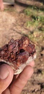 Check out the beautiful deep red inclusions and wild etchings on this Colorado quartz crystal! | Colorado Geology