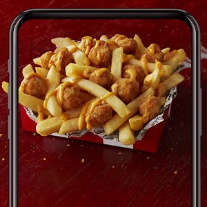 📱Only on the KFC App📱 This mini-box is giving major snack vibes. Get delicious KFC chips topped with Popcorn Chicken®️ and Supercharged sauce 🌶 all for just $2.95. Only in Western District and not forever. | KFC