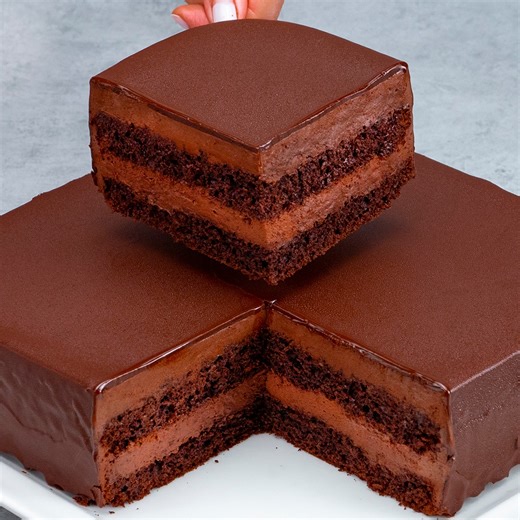 I can't resist this delicious dessert! The cake that melts in your mouth! Ingredients: eggs: 4 pc sugar: 200 g (7.1 oz) vanilla sugar: 10 g (0.4 oz) oil: 100 ml (3.4 fl oz) flour: 190 g (6.7 oz) cocoa: 20 g (0.7 oz) baking powder: 10 g (0.4 oz) The cream: vanilla flavored pudding powder: 80 g (2.8 oz) sugar: 200 g (7.1 oz) cocoa: 30 g (1.1 oz) milk: 1 l (34 pt) soft butter: 150 g (5.3 oz) whipping cream: 200 ml (6.8 fl oz) The glaze: dark chocolate: 200 g (7.1 oz) butter: 90 g (3.2 oz) | Cookrat