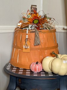 This big guy, made from a Hobby Lobby bushel basket is the perfect porch decor for the fall! | The Sugar Shack With Mrs. Munson