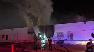 Smoke pours from commercial building fire near Las Vegas Strip
