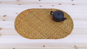 4PCS Handwoven Oval Straw Placemats – Vintage Woven Table Mats for Tea Tables and Dining, Rustic Natural Design.