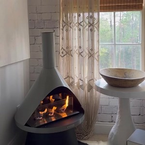 Enjoy crackling fire, warm flames and mood-evoking colors indoors or outdoors. Perfect for dinner parties, cocktail hours and outdoor patio gatherings. The Lloyd Fireplace blends the latest in mid-century modern inspired design with an electroplated steel body. | Solo Stove