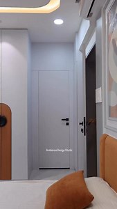 Modern geometry meets refined neutrals. ✨ The warmth of the Orange-Tan accent perfectly balances the cool Light Grey wardrobe. Completed with matte Black handles for a sharp, contemporary look. Design is all in the details🩶🧡🖤 | Ambience Design Studio
