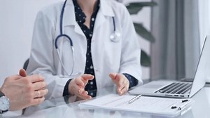 clip-3485106077-doctor-patient-female-physician-sitting-glass-table