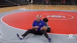 Head Wrestling Coach Dave Crowell of Nazareth Area High School demonstrates changeovers from the bottom position. Watch this full-length session and more with Wrestling Coaches Insider Plus: https://bit.ly/42RSD0S | Wrestling Coaches Insider