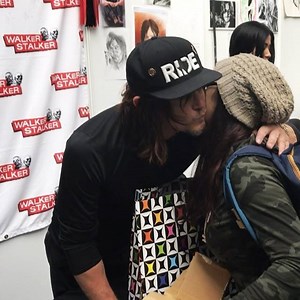 A fan brought Norman Reedus a custom mug, and he immediately put his coffee in it...and gave her a kiss on the cheek! | Walker Stalker