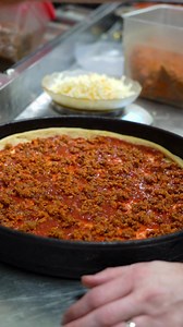 People are loving the new Sloppy Joe Pizza at Happy Joe's! This new pizza creation is served on our Pan-Style crust and topped with 100% real ground beef, blended with Happy Joe’s special sloppy joe sauce and covered with mozzarella, provolone, and cheddar cheeses, and garnished with classic dill pickles and yellow mustard. Order now at HappyJoes.com. | Happy Joe's Pizza
