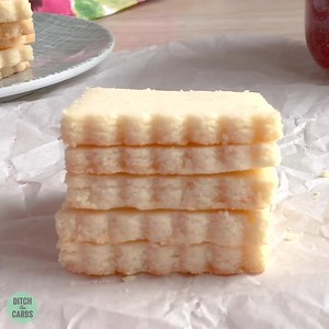 1.2K views · 39 reactions | NEVER mess with this shortbread ... this is why! PRINT/SAVE THE RECIPE: https://www.ditchthecarbs.com/buttery-keto-shortbread-cookies-video/ Buttery, light, soft, shortbread ... that's sugar-free and EASY to make PLUS it's only 1.8g net carbs this buttery and flakey cookie is exactly what you need with your cuppa. | Thinlicious | Facebook