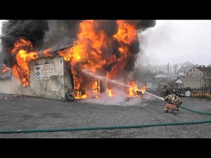 PRE-ARRIVAL: Firefighters battle fire in auto repair shop, North Whitehall, PA.