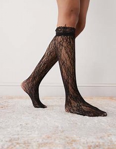 Reclaimed Vintage knee length lace socks with ruffles in black | ASOS