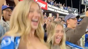 Shock moment women flash boobs in crowd during MLB clash
