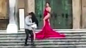 Woman poses naked on stairs of Amalfi cathedral
