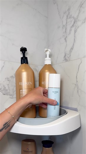 Rust-proof lazy susan shower shelves from Amazon! 😍🙌🏼 They are self-adhesive, hold up to 20 lbs, and even have a spot to hang a towel or hand towel! https://links.thesistershoppers.com/amzn/F4xza | The Sister Shoppers