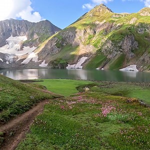 Gattian Lake, Neelam Valley, Kashmir 🇵🇰💚⛰️🚣‍♂️🏊‍♀️💦👏 YouTube in [4K] https://youtu.be/oEOec0srAAQ If you’re looking for a lake in pretty settings, Gattian Lake certainly fits the bill. This elongated lake, with its glacial waters, is framed by the snow-capped mountains that will leave you in awe! The lake is completely the product of glacial runoff and precipitation, hence the water’s clarity and turquoise hue that makes it hit with photographers. The best place to view this elongated bod