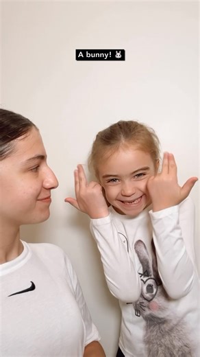 Celebrate #NationalPetDay with some pawsome ASL signs! Show your love to your furry (or feathered, or scaled) friend with these easy-to-learn signs. VD: Savannah is wearing a white t-shirt with a Nike logo at the top in the middle in front of an off-white background. Nathalie has a white long sleeve with a picture of a bunny on it. Penelope has a t-shirt with a swirl of pink, blue, and purple. #ASL #PetsOfInstagram #DeafCulture #deafkidsrock #furryanimals #petsarethebest #signwithme #americansig