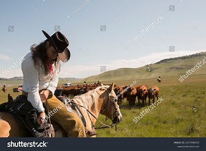 Female Rancher Horseback Adjusting Saddlebag Herding Stock Photo 2217996255 | Shutterstock