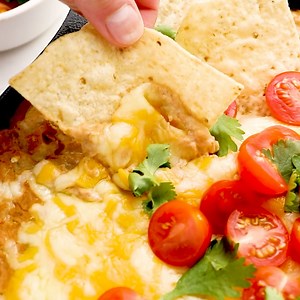 This Cheesy Refried Bean Dip consists of less than 10 ingredients and takes only 30 minutes to make! This hot bean dip is a great appetizer to serve on special occasions such as Cinco de Mayo, the big game day, work events, and more! RECIPE: https://www.thecookierookie.com/refried-bean-dip/ | The Cookie Rookie
