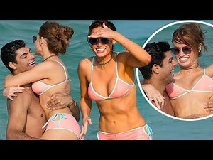 Swimsuit model Haley Kalil cozies up to Luca Castellani on the beach