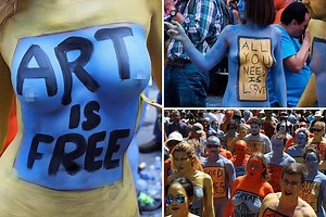 Hundreds of models pose completely NAKED in Times Square daubing themselves in paint to celebrate body positivity