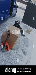 Adult Man Slips and Falls on Ice While Carrying Box From Van. Woman Runs From Warehouse to Help Injured Colleague. CCTV Footage, Winter Workplace Hazards and Slip Trip Fall Accidents. Vertical Shot Stock Video Footage - Alamy