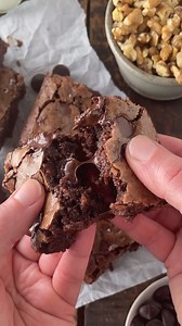 These dark chocolate brownies are the ultimate treat—just the right mix of chewy and fudgy, with a crackly top, a moist center, and an irresistible hit of rich dark chocolate. Ingredients * ⅓ cup unsweetened cocoa powder * ½ cup boiling water * 2 tablespoons boiling water * 2 ounces unsweetened chocolate, finely chopped * ½ cup vegetable oil * 2 tablespoons vegetable oil * 4 tablespoons butter, melted * 2 large eggs * 2 egg yolks * 2 teaspoons pure vanilla extract * 2 ½ cups granulated sugar * 1