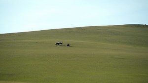 Horsemen and Motorcycle in Treeless Central Asian Steppes