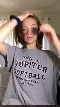 Beautiful redhead midway with super short bobbed hair after her 18 inch ponytail was chopped off.