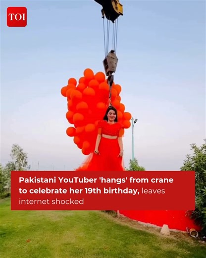 Pakistani YouTuber, #RabeecaKhan shocked viewers with her mid-air birthday photoshoot, which involved hanging from a crane. In the footage, the YouTuber can be seen suspended from the crane by a harness, with only a few feet between her and the ground. Details here 🔗 http://toi.in/rkp #Pakistan #PakistaniYoutuber | The Times of India