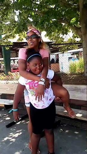 Strong kid lift carry Mom