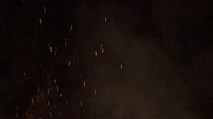 Close-up hot fiery sparkles and flame particles isolated spark.