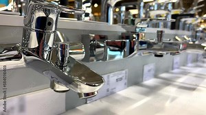 Chrome horizontal shower faucet kit on a rack at the plumbing and accessories store