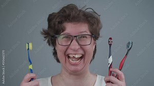 Toothless funny woman. Cute female smiling extensively with toothbrush in hand. Chunk of her front tooth has fallen out. The concept of dentistry and dental hygiene. Periodontal disease. Dental care