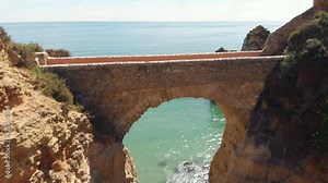 Arch bridge at Praia dos Estudantes (Students Beach) in Lagos, Algarve, Portugal. Fly over