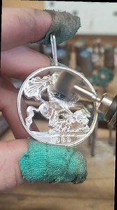 Crafting a pendant out of an old silver coin 🪙 This piece is a heavy sterling silver pendant depicting a soldier on a horse slaying a dragon Handcrafted from a Victorian sterling silver crown coin from the 1800s When ordered from us it will come on a 20 inch sterling silver belcher chain. Each one of these is made to order and can be found on our website! #silverhollowjewellery #handmadejewellery #coinpendant #victoriancoin #smallbusiness #handmadejewelleryuk #sustainablejewellery | Silver Holl