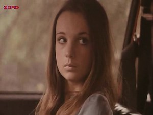 Christina Lindberg having a guy pull her shirt off in the