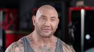 Dave Bautista explains the stories behind his tattoos, including covering up one after a friend came out as anti-gay