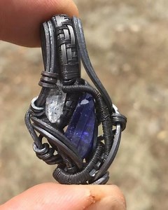 Tanzanite and Quartz Atomic Pendant Deep Space Edition Wrapped in Oxidized Sterling Silver and Titanium -Tanzanite (Arusha, Tanzania) -Quartz (Switzerland) Available, $175 #organicmechanics #atomicpendant #deepspaceedition #darkside #tanzanite #quartz #pendantsofig #wrapsofig #wirewrap #healingstones #healingcrystals #energy #highsociety #crystalporn #jewelryartist #jewelryaddict | Organic Mechanics Jewelry