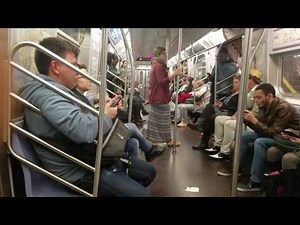 Homeless man gets kicked off F train by NYPD.