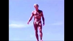 Tanned guy on beach in tiny string thong (temporarily!)