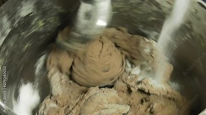 Machine dough kneading process for organic non-GMO bread without fillers and preservatives.