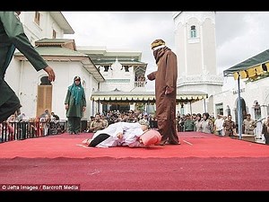 Muslim woman is caned 23 times in Indonesia for 'standing too close to her boyfriend'