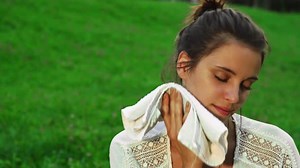 Girl Wipes Her Face From Sweat
