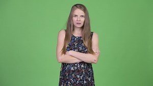 Young angry pregnant woman with arms crossed
