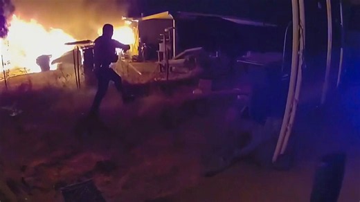 Police pull a man and a woman from a burning home in Arizona
