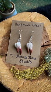 28 reactions | I’ve been having a lot of fun making some gnarly glass teeth lately! Fun fact- these are modeled after my actual collection of real human teeth.  Don’t worry though they’re ethically sourced (willingly given to me after dentist appointments by friends who wholeheartedly support my weirdness) lol. . . . #naturebonestudio #teethjewelry #humanteeth #flameworkedglass #teethearrings #altjewelry #wierdcore | Nature Bone Studio | Facebook