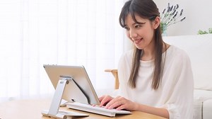 clip-1091967451-asian-woman-using-tablet-home