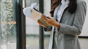 Download Business people using tablets And using his finger to touch the screen With a business graph showing up in a virtual screen.New startup ideas and business growth concept. for free