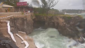 The live EarthCam feed shows rain and wind from Tropical Storm Rafael bringing rough seas and big waves to Rick's Cafe in Negril, Westmoreland, Jamaica, as of 1:30 PM on Tuesday, November 05, 2024. How is the weather in your area? | Weather Jamaica